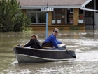 Roger Poirier, and his wife Crystal use their boat to collect belongings from their flooded house in High river, Alta. Heavy rains have caused flooding, closed roads, and forced evacuation in High River, Alta., Thursday, June 20, 2013.THE CANADIAN PRESS/Jeff McIntosh Roger Poirier, and his wife Crystal use their boat to collect belongings from their flooded house in High river, Alta. Heavy rains have caused flooding, closed roads, and forced evacuation in High River, Alta., Thursday, June 20, 2013.THE CANADIAN PRESS/Jeff McIntosh
